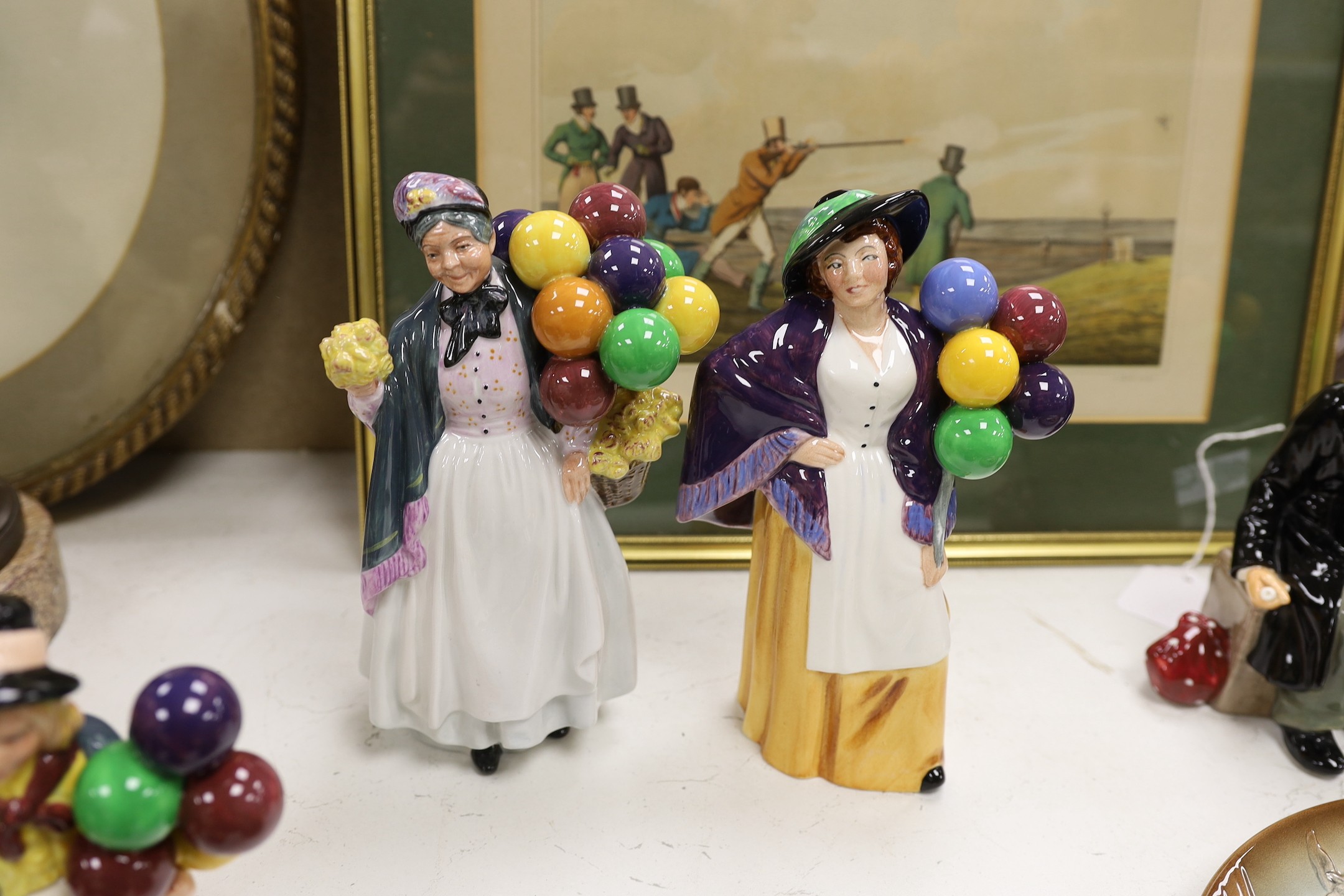 Seven Royal Doulton balloon seller figures in various sizes, a similar teapot and a dish (9), tallest Biddy Penny Farthing, 22cms high